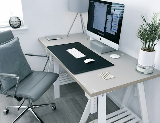 Home office desk with monitor and chair