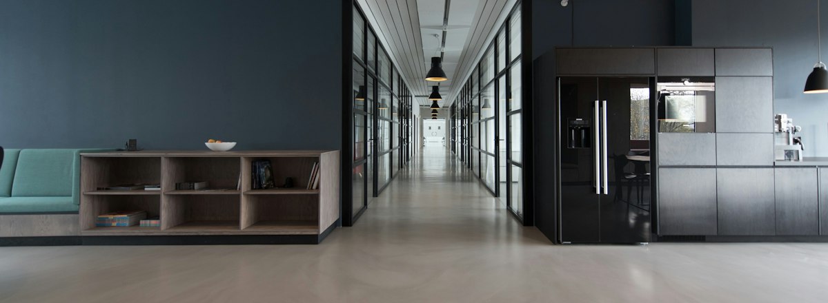 Quiet office interior with long tables